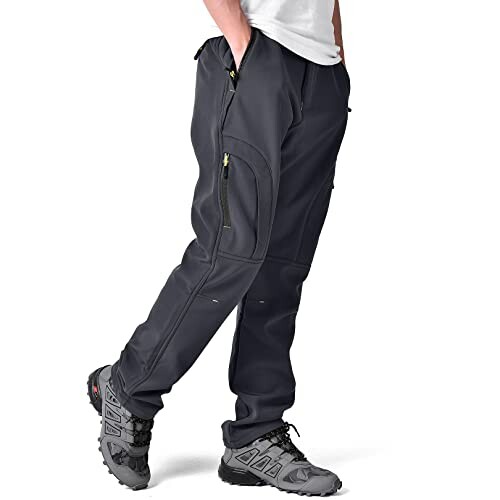 Person wearing black cargo pants and hiking shoes