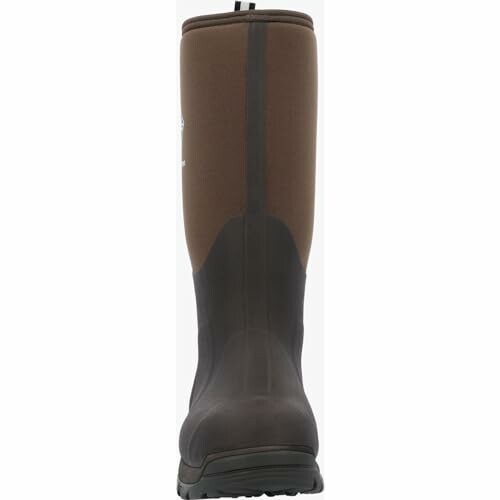 Back view of a tall brown rubber boot